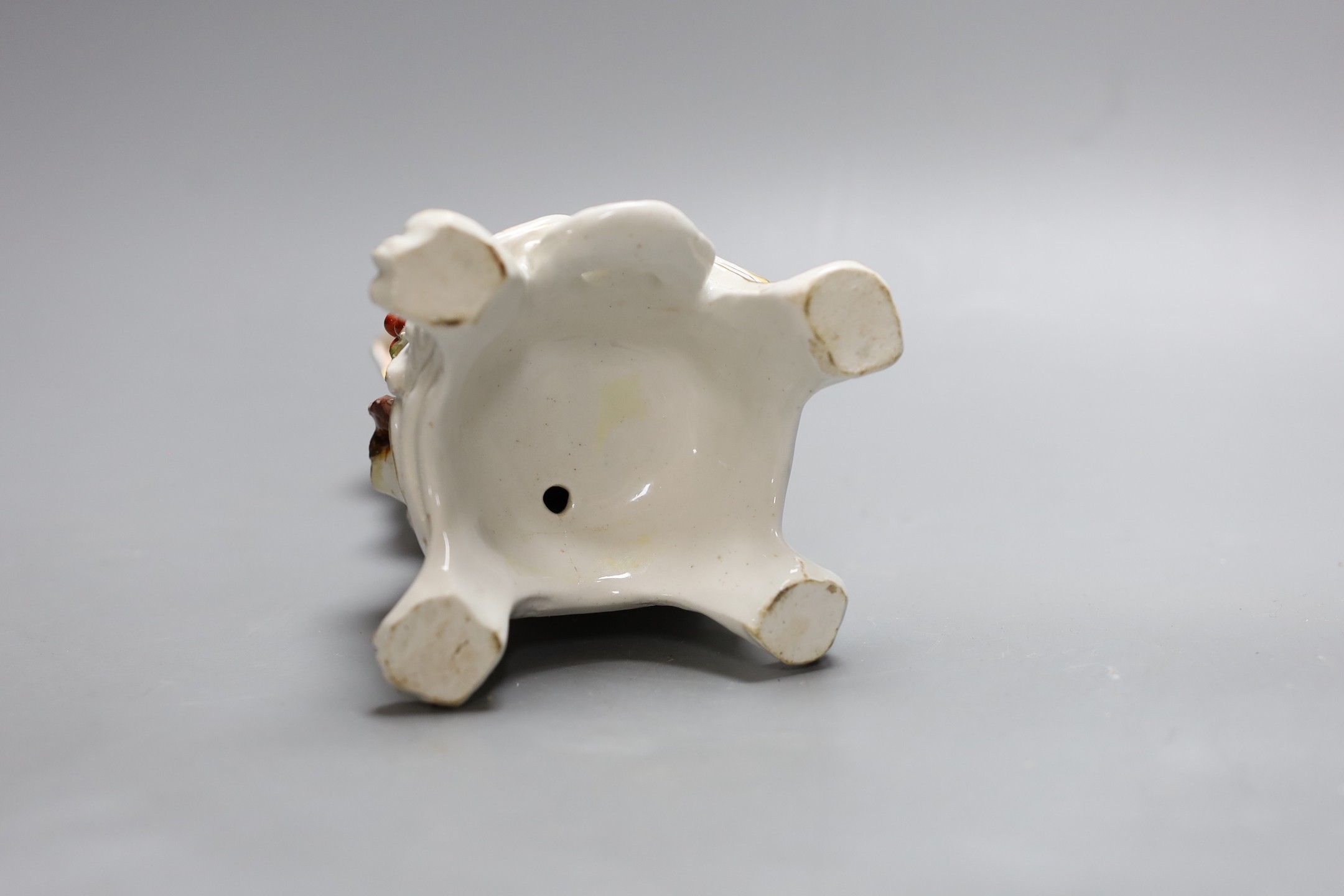 A Bow figure of Winter on a scroll moulded base painted with flowers, having an anchor dagger mark in red, 16.5 cms high